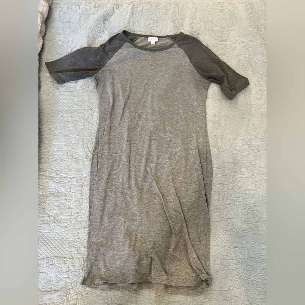 Barley used. Great quality simple dress.